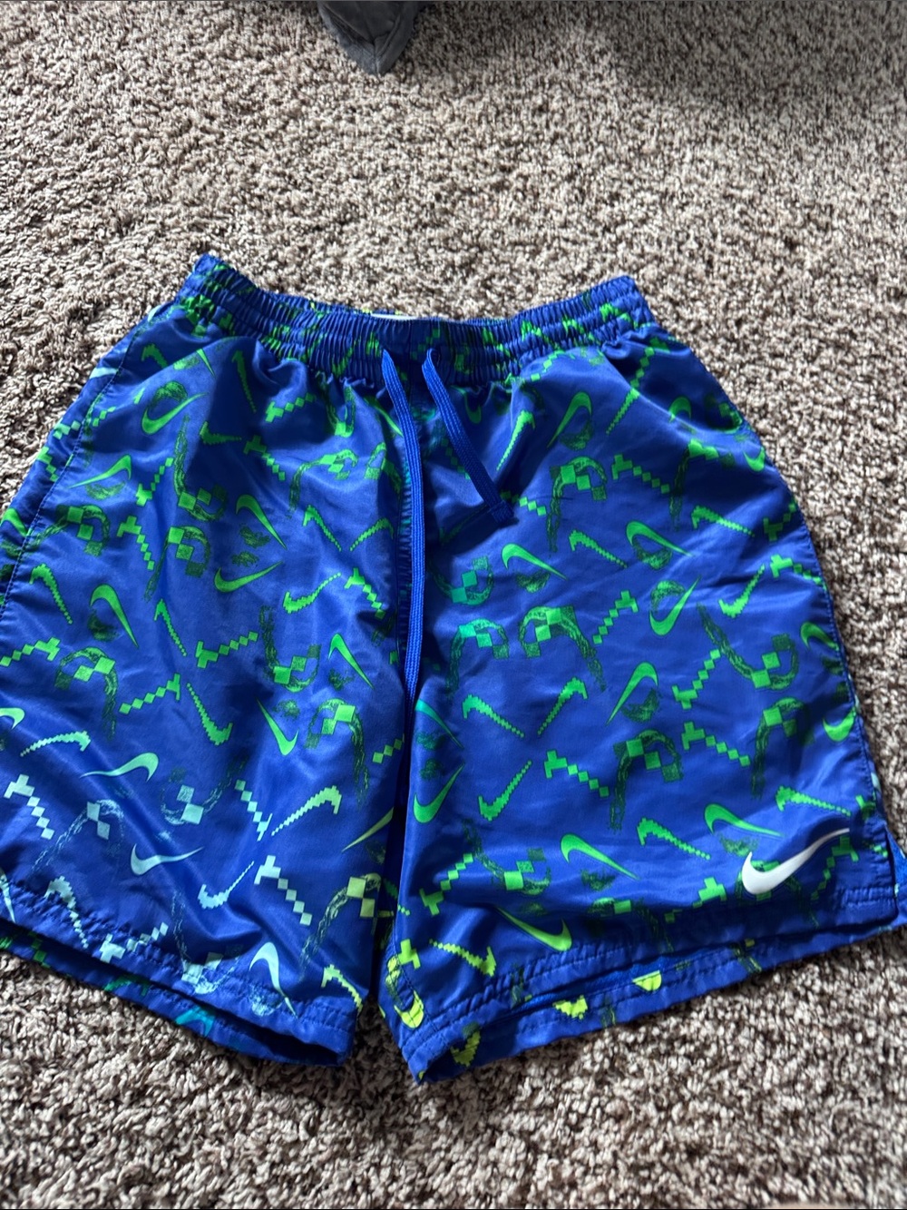 Nike Blue Shorts with Neon Green Swoosh Pattern